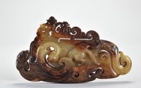 A Carved Russet Jade Dragon Pendant