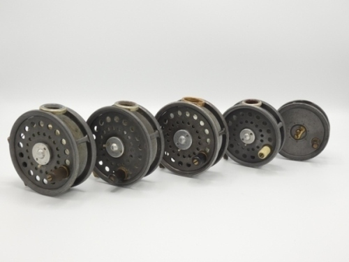 Three Walker Bampton 3 ¾" alloy lightweight salmon/sea-trout fly reels, each with composition handle, brass foot, rim tension screw, two with agate line guides one metal, one reel lacking check spring and pawl, a Dingley made 3 ¼" trout fly reel, lacking
