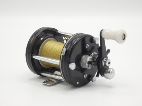 A very rare Abu Ambassadeur 6000 black finish bait casting reel, grooved rims, counter-balanced single crank handle above a black five point star drag wheel, rim spool release button and rear graduated spindle tension adjuster, no foot number and in orig