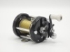 A very rare Abu Ambassadeur 6000 black finish bait casting reel, grooved rims, counter-balanced single crank handle above a black five point star drag wheel, rim spool release button and rear graduated spindle tension adjuster, no foot number and in orig