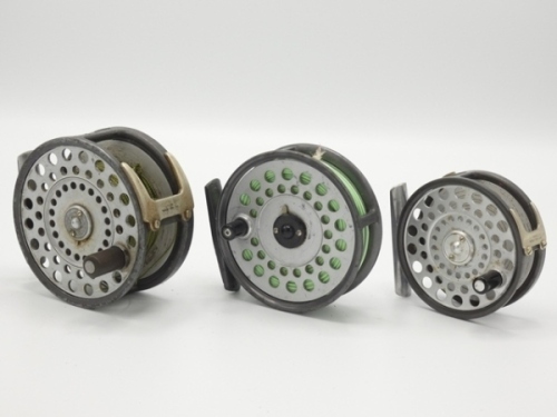 A good Hardy Featherweight trout fly reel, composition handle, alloy foot, two screw drum latch, nickel silver two screw "U" shaped line guide, rim tension screw and compensating check mechanism, little used condition a Hardy Zenith wide drummed trout fl