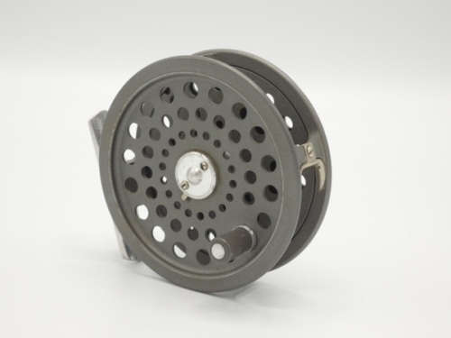 A Hardy JLH Ultralite #7 trout fly reel, grey anodised finish, alloy foot, two screw drum latch, rear spindle tension adjuster, light use, in cloth bag and a Hardy "Sovereign" 4 piece carbon trout fly rod, 10'6", #7/8, crimson/scarlet tipped wraps, wooden