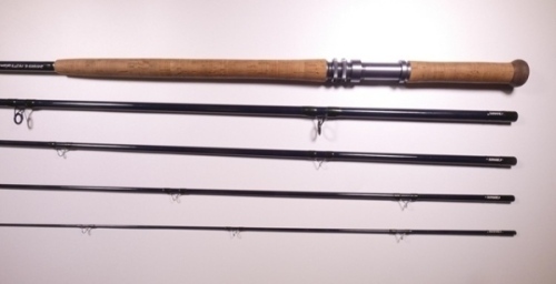 A Thomas & Thomas "DH1409-5" five piece carbon salmon fly rod, 14', #9, blue silk wraps, anodised screw grip reel fitting, light use, in bag and cloth covered tube