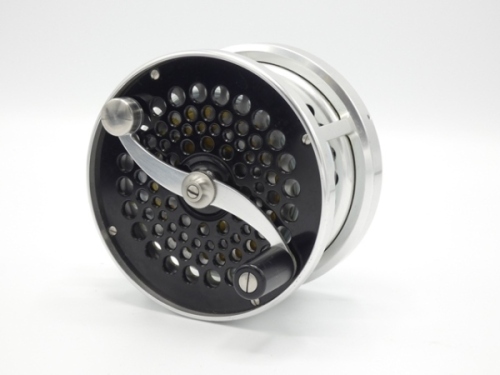 A fine Saracione Mk.IV 4 ¼" salmon fly reel, right hand wind model with counter-balanced serpentine scroll handle, ventilated cage and faceplate, block foot, rear spindle mounted milled tension adjuster and sliding stepped alloy line clip, only very light