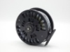 A good Abel Super 12 salmon/saltwater fly reel and two spare spools, right hand wind model with black anodised finish, counter-balanced rosewood handle, ventilated large arbour drum, rear spindle mounted milled tension regulator, light use only, in origi - 2
