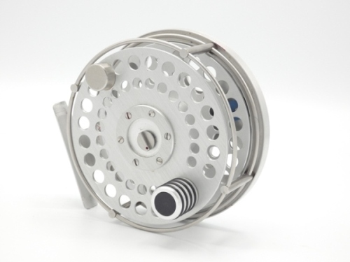 A scarce Ari't Hart Tweed salmon fly reel, right hand wind model with silver anodised finish, counter-balanced handle, stainless steel annular line guide, multi-perforated drum, rear plate with six circular finger ports, optional check button, spindle mo