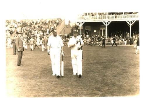 R.E.S. Wyatt and Hedley Verity. Scarborough 1936. Nice original mono real photograph plain back postcard of Wyatt walking out to bat at Scarborough with Hedley Verity. The match is assumed to be H.D.G. Leveson-Gower's XI v M.C.C. Australian Touring Team, 