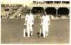 Herbert Sutcliffe and Arthur Mitchell. Original mono real photograph postcard of Sutcliffe and Mitchell walking out to bat at Scarborough. Match unknown but c.1934. The photograph by Walkers Studios of Scarborough. VG - cricket