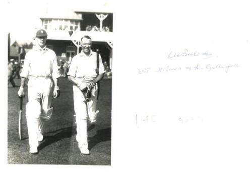 E.R.T. Holmes and A.[?] Gilligan. Original mono real photograph postcard of Holmes and Gilligan walking out to bat at Scarborough. Inscribed to verso 'ERT Holmes &amp; A Gilligan' but most probably Frank Gilligan who both played together for M.C.C. at Sca