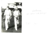 E.R.T. Holmes and A.[?] Gilligan. Original mono real photograph postcard of Holmes and Gilligan walking out to bat at Scarborough. Inscribed to verso 'ERT Holmes &amp; A Gilligan' but most probably Frank Gilligan who both played together for M.C.C. at Sca