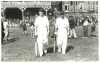 Ken Cranston and Norman Yardley. Original mono real photograph plain back postcard of Cranston and Yardley walking out to bat at Scarborough. Match unknown but probably c.1950. Photographer unknown. VG - cricket<br><br>Ken Cranston's first-class career sp
