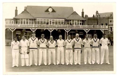 Scarborough Cricket Festival c.1955. Mono plain back postcard of a team standing in one row wearing cricket attire, with the Scarborough pavilion in the background. The team appears to be Gentlemen for the match v Players, 3rd- 6th September 1955. Players