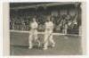 Percy Holmes and Herbert Sutcliffe. Mono real photograph postcard of Holmes and Sutcliffe walking out to bat. Nicely signed in black ink to the photograph by both players. Publisher unknown. VG - cricket