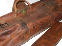 Legh Barratt. Norfolk C.C..C. 1890 to 1908. Large original leather 'cigar shaped' cricket bag and bat used by Barratt during his playing career. The leather bag, by George G. Bussey &amp; Co Ltd, with players name printed to side 'Legh Barratt' in black, 