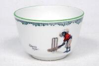 'There's Style!'. A rare Royal Doulton 'Black Boy Series Ware' china sugar bowl entitled 'There's Style!' printed with a boy in red shirt and a floppy hat standing in front of his stumps in batting pose, 'The All Black Team' crest to reverse. Green floral
