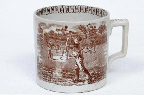 Cricket mug. Victorian mug with transfer printed scenes to both sides of a cricket match in progress to background and to foreground a fielder, wearing a cap, attempting to make a catch printed in brown. Decoration to top inside rim and to the handle, als