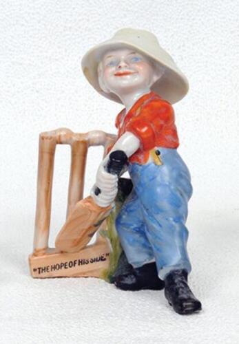 'The Hope of his Side'. Kinsella 5.5&quot; caricature spill vase of a young boy in batting stance in front of the wickets. Printed title below wickets and bat. 'Copyright' stamp to base. German circa early 1900's. 5.5&quot;. Some very minor wear otherwise