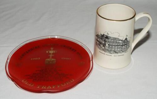 'Lancashire County Cricket Club. Member's Pavilion, Old Trafford'. Sandland Ware ceramic tankard with transfer printed Club crest and the pavilion to each side. Gilt lustre to rim and handle. 5" tall. Sold with a glass plate commemorating Gillette Cu