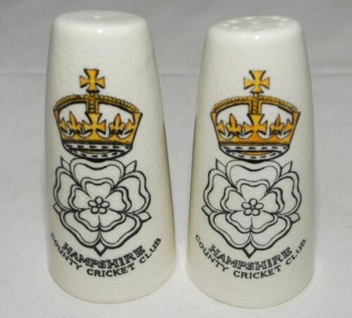 Hampshire County Cricket Club. Pair of salt and pepper pots with transfer printed colour image of the Hampshire emblem and name beneath to each pot and name printed beneath. Lancaster &amp; Sandland Ltd. 4" tall. Lacking stoppers to bases. G - cricke