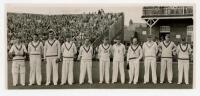 H.D.G. Leveson-Gower's XI v Australians, Scarborough 1947. Original mono photograph of the Leveson-Gower XI standing in one row wearing cricket attire in front of the pavilion, for the match played 8th- 10th September 1948. Players are Robins (Captain), H