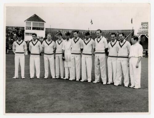 South Africa tour to England 1960. Scarborough Festival. Original mono press photograph of the South African team lined up in one row wearing cricket attire, the grandstand in the background, for the match v T.N. Pearce's XI, 7th- 9th September 1960. Play