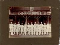 Eton College 1914. Two original mono photographs of teams standing in one row wearing cricket attire, in front of the pavilion at Agar's Plough, Eton College. Both photographs annotated in pencil to lower border, 'Eaton [sic] 1914'. Each photograph measur