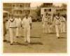 The Ashes. England v Australia 1938. Five original sepia press photographs of action from the first Test at Trent Bridge, 10th- 14th June 1938. Two images from the first day's play depict Bradman leading his side out to field at the start of play, and Eng