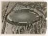 'Bodyline'. M.C.C. tour to Australia 1932/33. Large original mono press photograph of an aerial view of the Melbourne Cricket Ground seen with large crowds in attendance and a packed car park in the background. The photograph appears to have been retouche