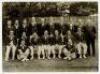 Australia tour to England 1934. Official mono press photograph of the full Australian touring party seated and standing in rows wearing tour blazers. Players featured include Woodfull (Captain), Bradman, Chipperfield, Ebeling, Kippax, McCabe, Oldfield, Fl