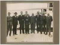 South Africa tour to England 1935. Official mono photograph of M.C.C. officials H.G. Owen-Smith, P.F. Warner, A. Melville, A.J. Webbe, Viscount Cobham, S.J. Snooke, H.D.G. Leveson Gower, and England captain, Percy Chapman gathered on board the Union Castl
