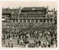 West Indies tour to England 1963. Excellent large original mono press photograph depicting the iconic scenes of large crowds on the pitch and looking down from the pavilion to celebrate West Indies winning the fifth Test at The Oval, 22nd- 26th August 196