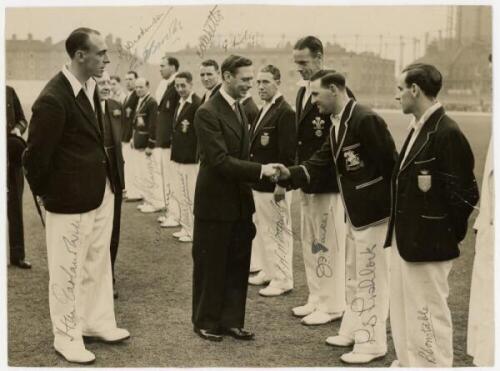 Surrey C.C.C. 1939. Original mono press photograph of the Surrey team being presented to King George VI at The Oval. The photograph signed in ink by all twelve players. Signatures are Monty Garland-Wells (Captain), Patrick Dickinson (10 matches 1939), Te