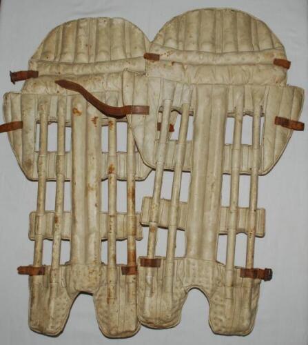 'Skeleton Leg Guards'. Pair of original late 19th century open ribbed (skeleton) cane and leather cricket pads with side flaps, possibly wicketkeeping pads. Some wear and staining, loss to some leather straps, otherwise in good condition - cricket