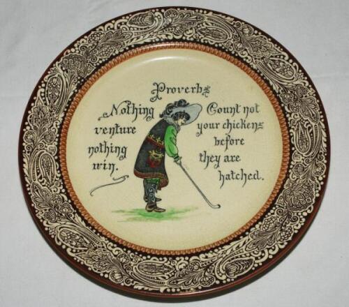 Royal Doulton Golfing Series Ware proverbs plate c1915. Decorated with a 17th century golfer with the proverb 'Nothing venture, nothing win and Count not your chicken before they are hatched'. 10.5&quot; diameter. Royal Doulton mark to base and makers bac