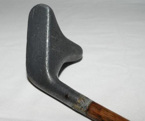 Fred Saunders Straight-Line patent putter. c.1920. Aluminium head with extended sole to rear, hickory shaft and leather grip. The crown with alignment aid, stamped 'Fred Saunders Highgate N', the sole stamped 'Regd. No. 672159 Straight Line Putter. Medium