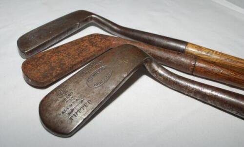 Blade putters c.1895. Three hand forged putters with maker's marks for T.S.M. Allan, Lethamhill, W.S. Collins, Northwich, and C.M. Millar, Glasgow. Hickory shafts and leather grips. Good original condition - golf