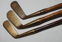 Three blade putters with brass heads c.1915-1925. Maker's marks for G.H. Taylor (Cann &amp; Taylor)/ Robinson &amp; Co. Singapore, 'MCF', and Glasgow Golf Club 'Thistle Brand'. Hickory shafts, two with suede grips, the other leather. Good original conditi