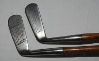 Two blade putters with steel heads c.1920. Maker's marks for R. Forgan &amp; Son St. Andrews, and Glasgow Golf Co. Hickory shafts with leather grips. Good original condition - golf