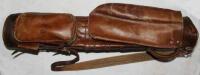 Leather golf bag c.1915 with carrying strap and handle, hood and side pocket. Owner's initials 'J.F.B.' to side pocket. Maker unknown. Good condition - golf