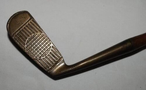Brass 'Rustless P.A.R.' putter by Klin McGill of Valparaiso Indiana c.1925 with golf ball decorated face. Hickory shaft with leather grip. Good original condition - golf