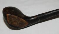Early 'Scared Head Brassie' (fairway driver) golf club c.1895. Maker unknown. Wooden head with brass plate and metal insert to rear, hickory shaft and suede leather grip. Good original condition - golf