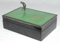 Golf cigarette box c.1920s. Original cigarette box with hinged lid with a silver metal figure of a golfer set on a green surface about to putt into a hole set on the front corner of the lid. Overall approx. 6.5&quot;x4.5&quot;x3.5&quot;. Slight staining t