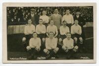 'Tottenham Hotspur Cup Team 1910'. Early mono real photograph postcard of the team and officials, standing and seated in rows on the pitch with the large crowd behind them, for the matches played at White Hart Lane, with printed title 'Tottenham Hotspur C