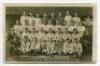 Tottenham Hotspur F.C. 1919/20. Mono real photograph postcard of the team and officials standing and seated in rows, with title printed to lower border 'Tottenham Hotspur. League Champions II Div. Winners Norwich Charity Cup. Season 1920. Winners London 