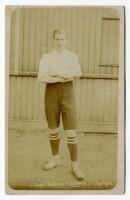 James Gray. Tottenham Hotspur 1907/08. Sepia real photograph postcard of Gray, full length, in Spurs attire. Title to lower border. F.W. Jones, Tottenham. Postally unused. Slight fading to image otherwise in good condition - football<br><br>James Gray pla