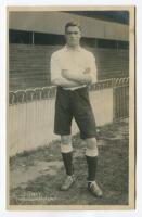 James Edward Elliott. Tottenham Hotspur 1912-1920. Mono real photograph postcard of Elliott, full length, in Spurs attire. Title to lower left hand border. F.W. Jones, Tottenham. Postally unused. Minor silvering to two corners otherwise in good/very good 