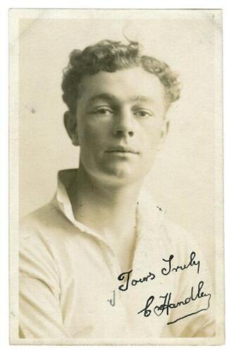 Charles Harold James Handley. Tottenham Hotspur 1921-1929. Sepia real photograph postcard of Handley, half length, in Spurs shirt. Signed in ink 'Yours truly, C. Handley'. W.J. Crawford of Edmonton. Good/very good condition Postally unused - football<br>