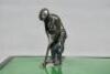 Golf cigarette box c.1920s. Original cigarette box with hinged lid with a silver metal figure of a golfer set on a green surface about to putt into a hole set on the front corner of the lid. Overall approx. 6.5&quot;x4.5&quot;x3.5&quot;. Slight staining t - 7