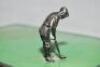 Golf cigarette box c.1920s. Original cigarette box with hinged lid with a silver metal figure of a golfer set on a green surface about to putt into a hole set on the front corner of the lid. Overall approx. 6.5&quot;x4.5&quot;x3.5&quot;. Slight staining t - 8
