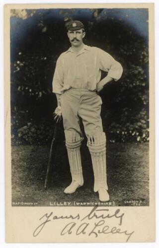 Arthur Frederick Augustus 'Dick' Lilley. Warwickshire, London County &amp; England 1894-1911. Mono real photograph postcard of Lilley, full length, in cricket attire. Nicely signed in black ink by Lilley to lower border. Rapid series no. 1235. Postally un